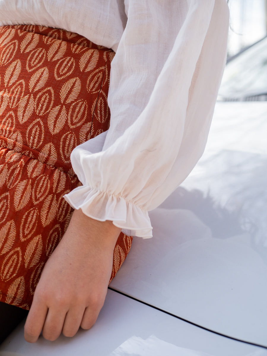 FALT01 Falda corta hoja naranja quemado