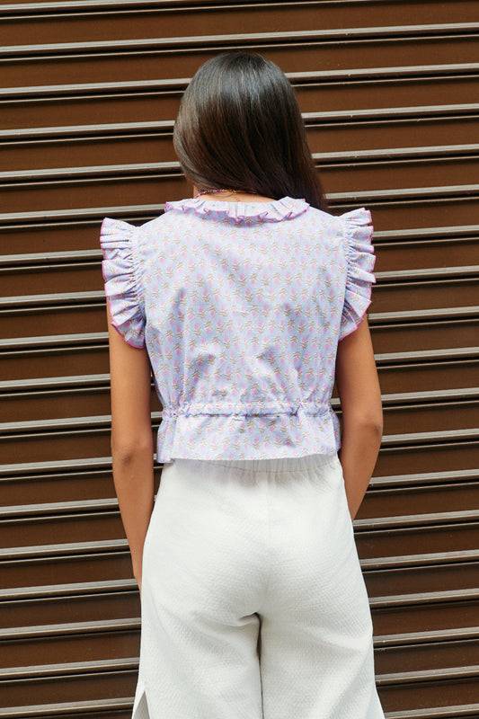 Blusa abotonada flor india