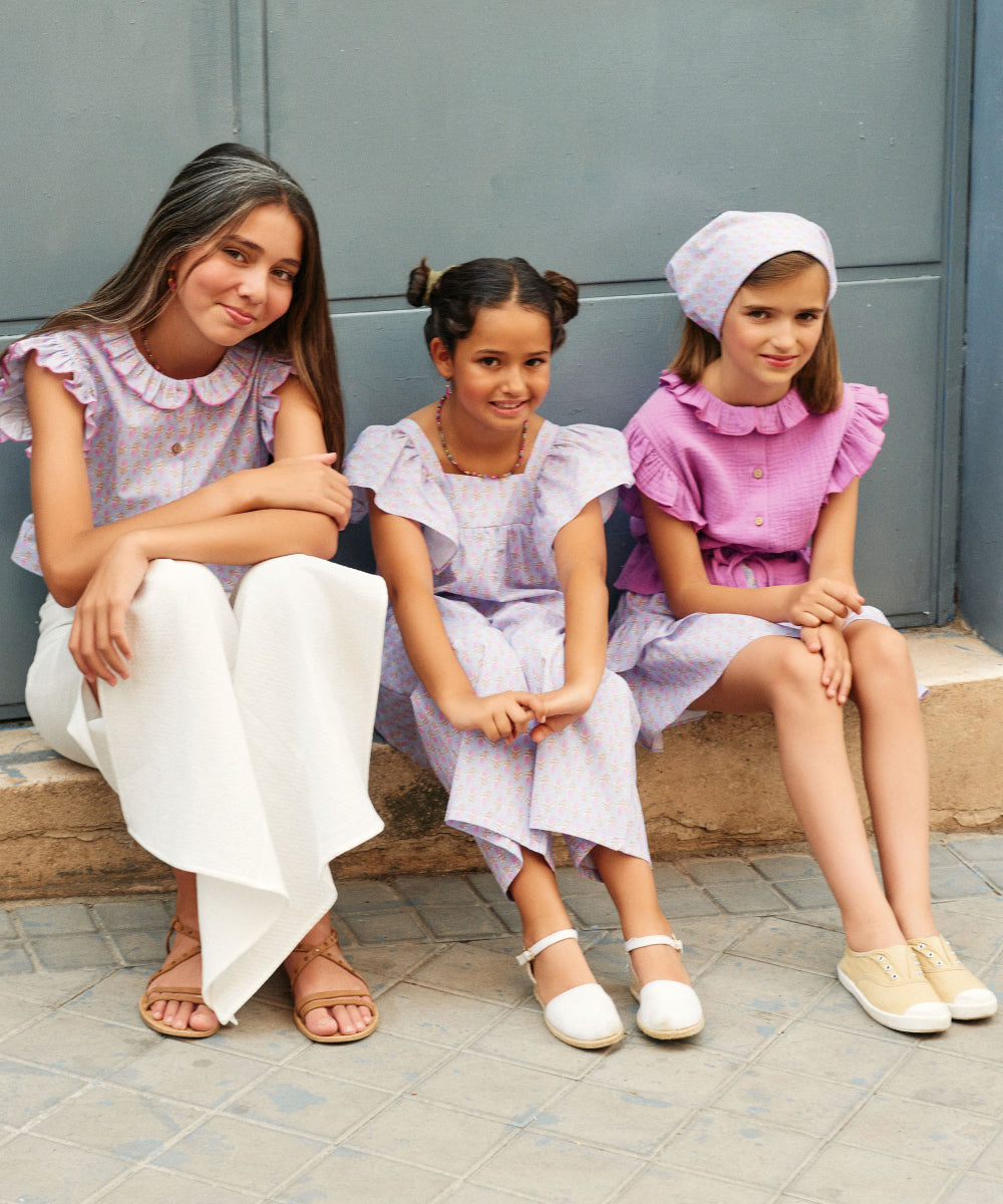 Blusa abotonada flor india