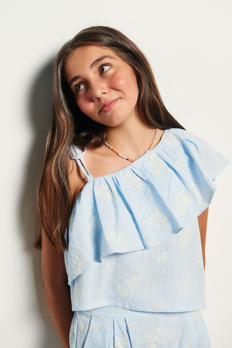 Blusa asimétrica volante bordado ramas