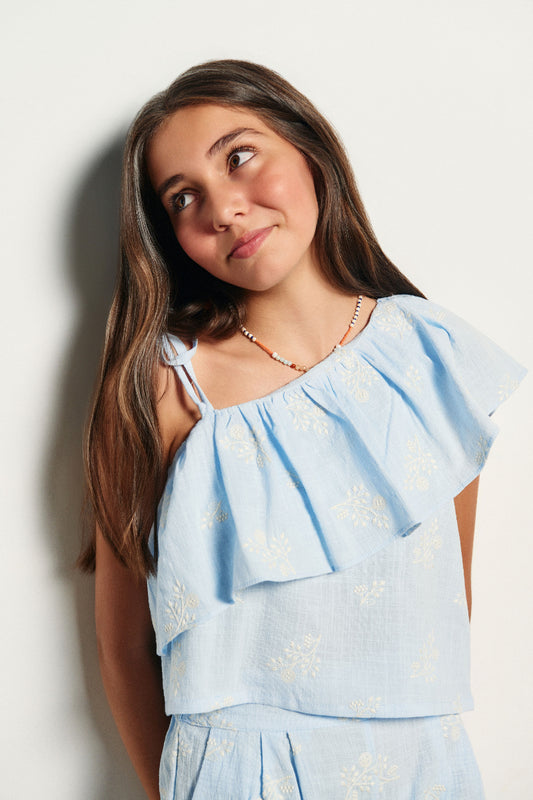 Blusa asimétrica volante bordado ramas